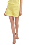 1.state Ruffle Hem Flat Front Shorts In Citrus Yellow