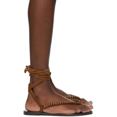 Saint Laurent Gia Ankle-wrap Beaded Suede Thong Sandals In Tan