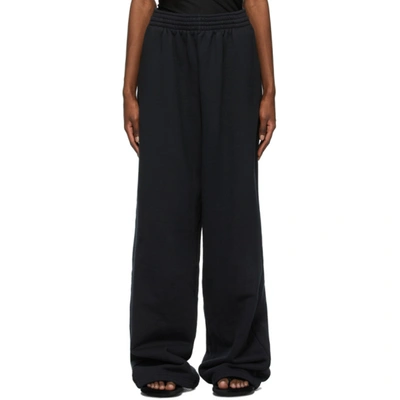 Balenciaga Wide Trousers With All Over Logo In Black