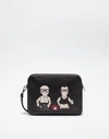 DOLCE & GABBANA HANDHELD POUCH WITH PATCHES OF DESIGNERS