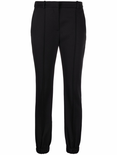 Alexander Mcqueen Elasticated-ankle Tailored Trousers In Black