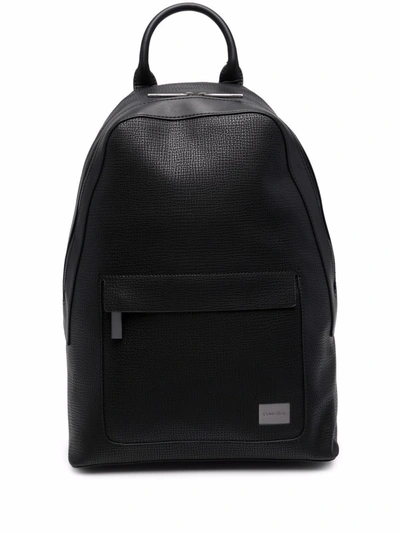 Calvin Klein Round Backpack In Textured Faux Leather With Logo Plate In Schwarz