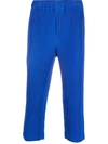 Issey Miyake Pleated Relaxed-fit Tapered Woven Trousers In Blau