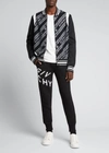 Givenchy Black Embroidered Refracted Logo Sweatpants In Black/white