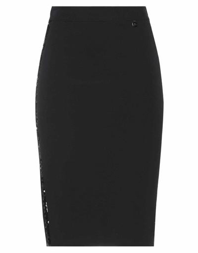 Akè Knee Length Skirts In Black
