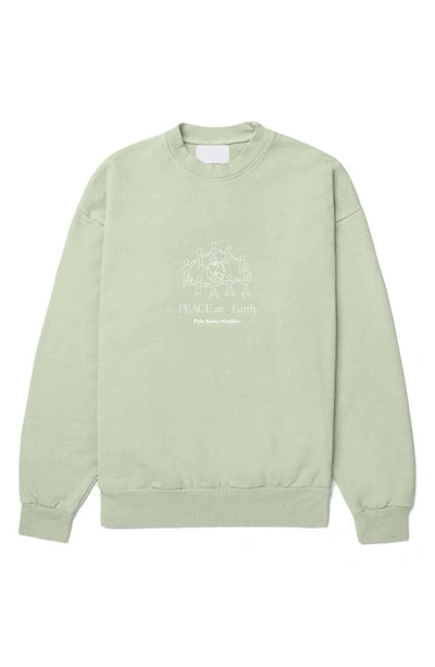 Palo Santo Studios Peace On Earth Graphic Sweatshirt In Mint Green