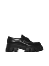 Prada Monolith Patent Leather Flatform Loafers In Nero