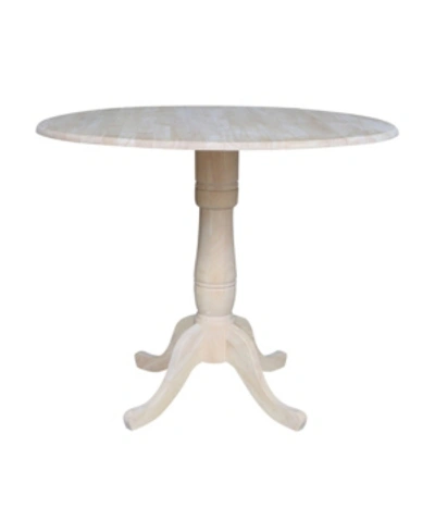 International Concepts 42" Round Dual Drop Leaf Pedestal Table In Cream