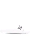 Moschino Embossed Logo Pool Slides In White