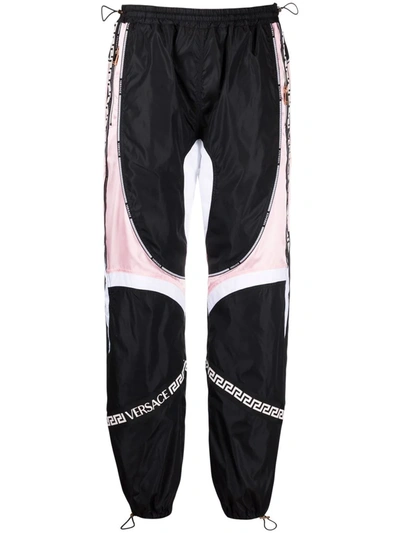 Versace Paneled Shell And Satin Track Pants In Black,pink