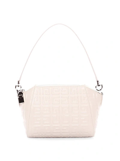 Givenchy Extra Small Antigona Logo Embossed Leather Bag In 105 Ivory