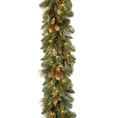 National Tree Company 9' X 10" Carolina Pine Garland With Flocked Cones & 100 Battery Operated Led Lights In Green