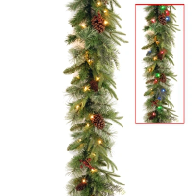 National Tree Company National Tree 9' X 10" Feel Real(r) Colonial Garland With 15 Pine Cones, 15 Red Berries And 50 Dual In Green