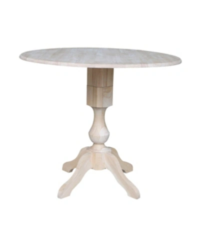 International Concepts 42" Round Dual Drop Leaf Pedestal Table In Cream