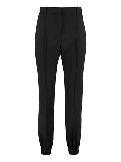 Alexander Mcqueen Elasticated-ankle Tailored Trousers In Black