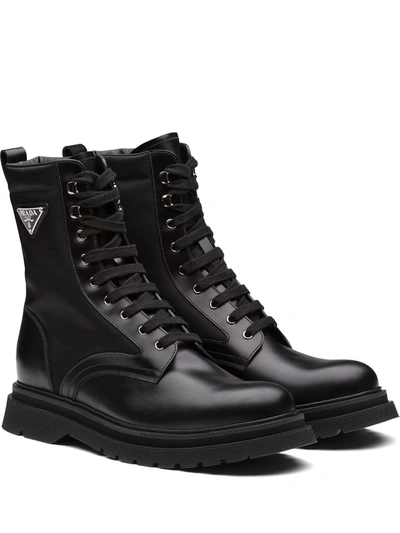 Prada Logo-plaque Panelled Ankle Boots In Black