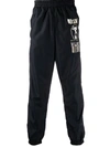 Moschino Warped Glitch Artworks Print Track Pants In Black