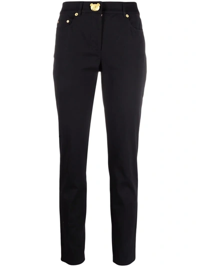 Moschino Teddy-plaque Slim-cut Trousers In Black