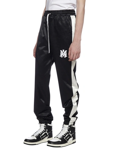 Amiri Logo Embroidered Trackpants In Black