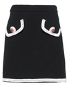Moschino Midi Skirts In Black