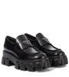 Prada Monolith Lacquered Leather Loafers In Black