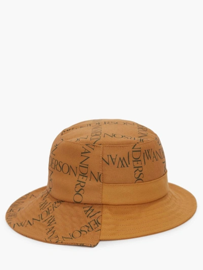 Jw Anderson Asymmetric Printed Canvas Bucket Hat In Yellow