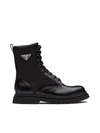 Prada Logo-plaque Panelled Ankle Boots In Black