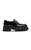 Prada Logo Plaque Spazzolato Leather Platform Moccasins In Black