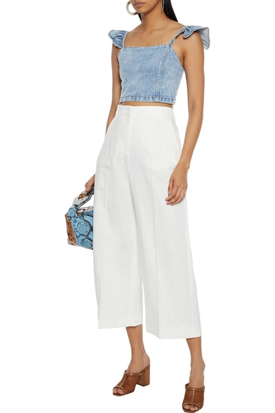 Alice And Olivia Kiley Cropped Ruffle-trimmed Acid-wash Denim Top In Light Denim