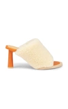 Jacquemus Women's Les Carre Rond Asymmetric Shearling Mules In White
