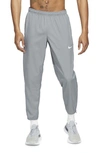 Nike Men's Dri-fit Challenger Woven Running Pants In Smoke Grey/reflective Silver