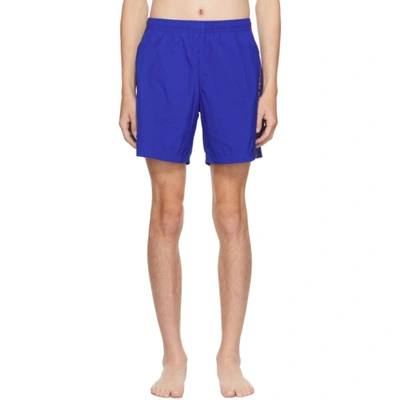 Alexander Mcqueen Logo-tape Slip-on Swim Shorts In 蓝色