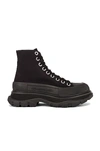 Alexander Mcqueen Leather And Rubber Exaggerated-sole Ankle Boots In Black