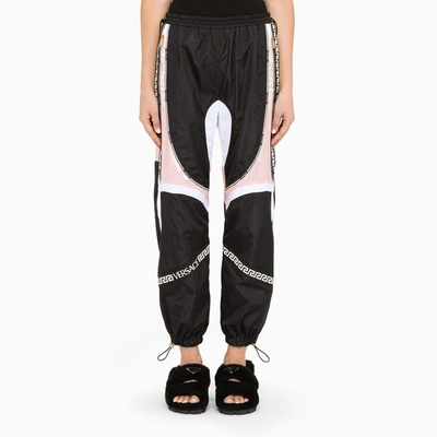 Versace Paneled Shell And Satin Track Trousers In Black,pink