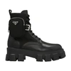 Prada Monolith Leather And Re-nylon Boots With Pouch In Nero