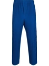 Issey Miyake Pleated Relaxed-fit Tapered Woven Trousers In Blau