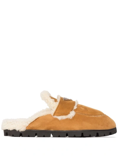 Prada Triangle-plaque Shearling Slippers In Brown