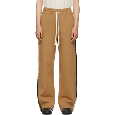 Jw Anderson Contrast Stitch Wide Leg Track Trousers In Brown