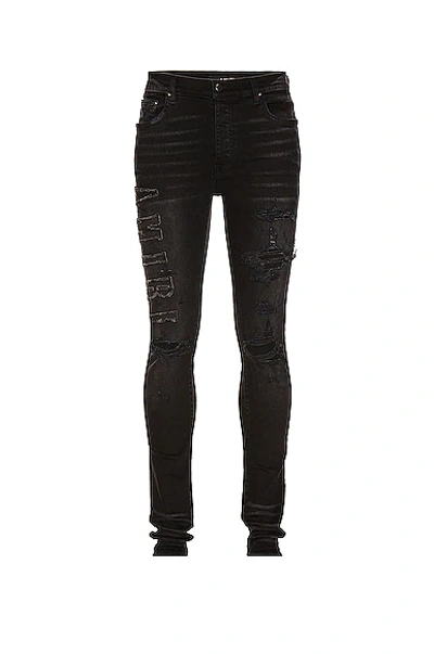Amiri Logo Applique Jean In Black