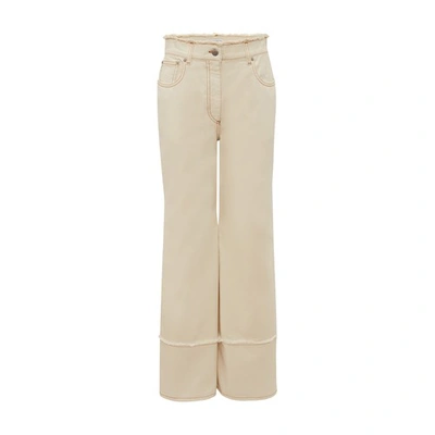 Jw Anderson Flared Raw-edge Jeans In Off_white