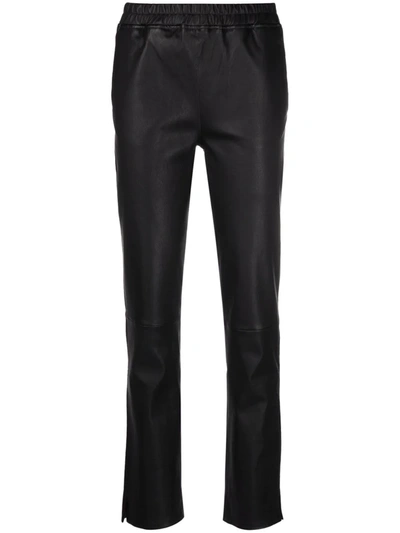 Arma Cropped Kick Flare Trousers In Black