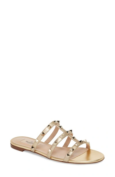 Valentino Garavani Rockstud Slide Sandal In Metallic Gold