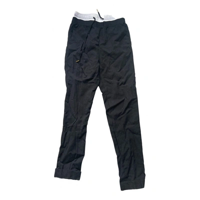 Pre-owned Sandro Wool Trousers In Black