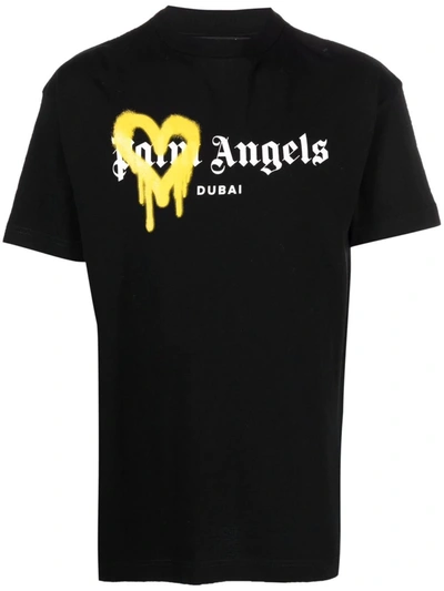 Palm Angels Man Black And Yellow Spray Logo Dubai T-shirt In Nero