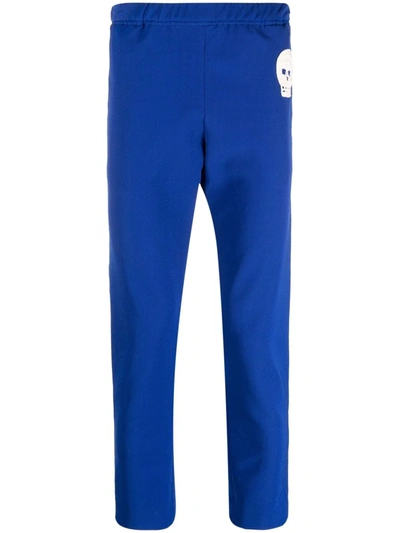 Alexander Mcqueen Jogging Trousers With Embroidered Skull In Blue