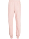 Alexander Mcqueen Logo Print Ribbed Track Pants In 粉色