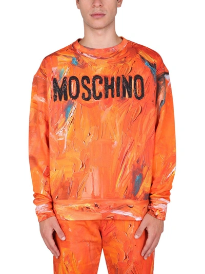 Moschino Painted Logo Crewneck Sweatshirt In Orange