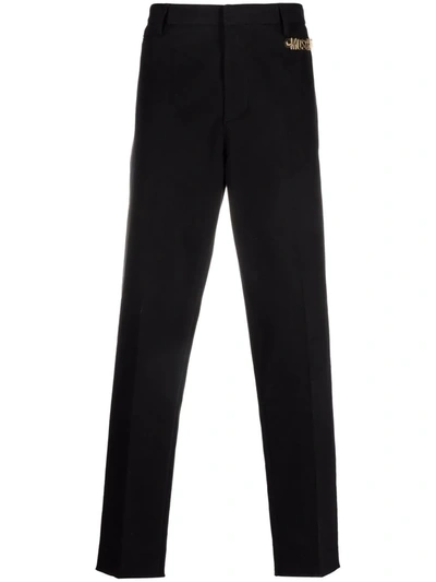 Moschino Logo Embellished Tailored Trousers In Black