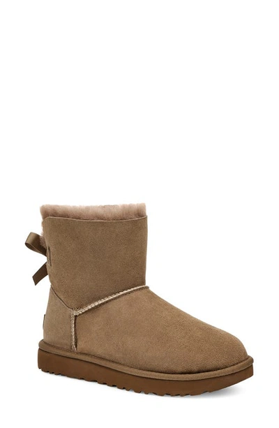 Ugg (r) Mini Bailey Bow Ii Genuine Shearling Bootie In Hickory