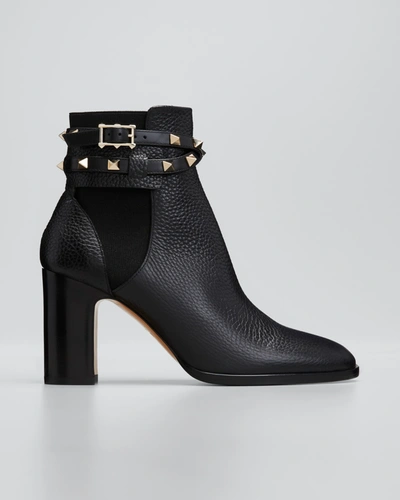 VALENTINO GARAVANI ROCKSTUD BUCKLE-WRAP ANKLE BOOTIES,PROD168570130